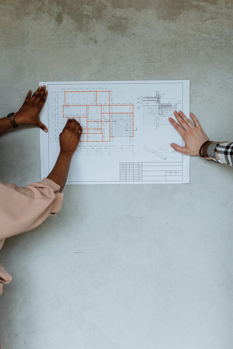 Close-up of a blueprint under review for site and civil drafting support