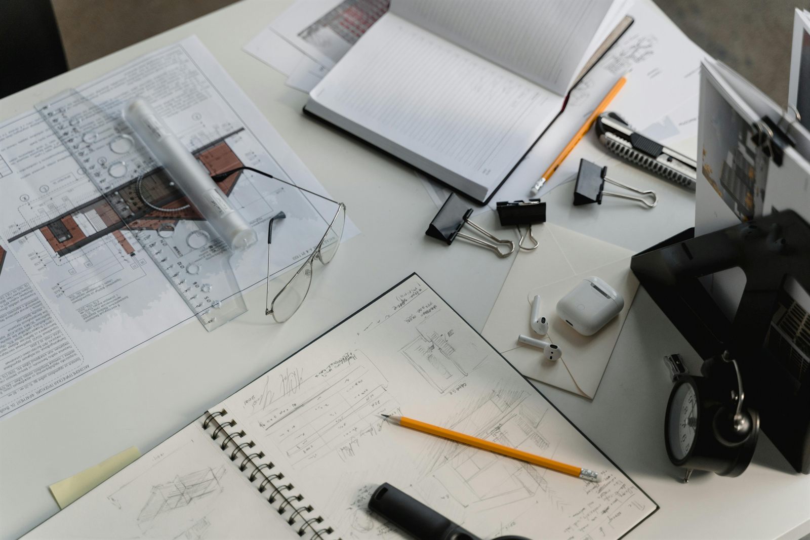 Architectural workspace with sketches and technical review tools